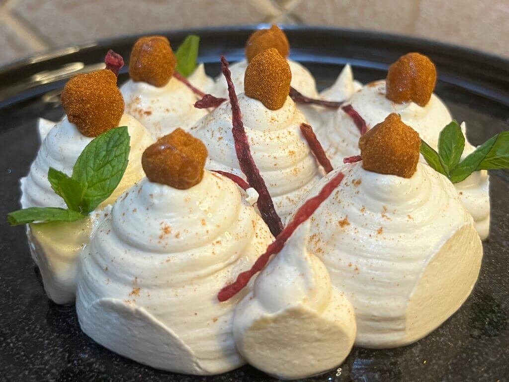 a plate of creamy hummus beautifully decorated