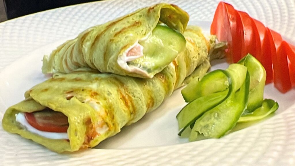 gluten free avocado egg wrap filled with labneh cucumber and tomato healthy low carb wrap