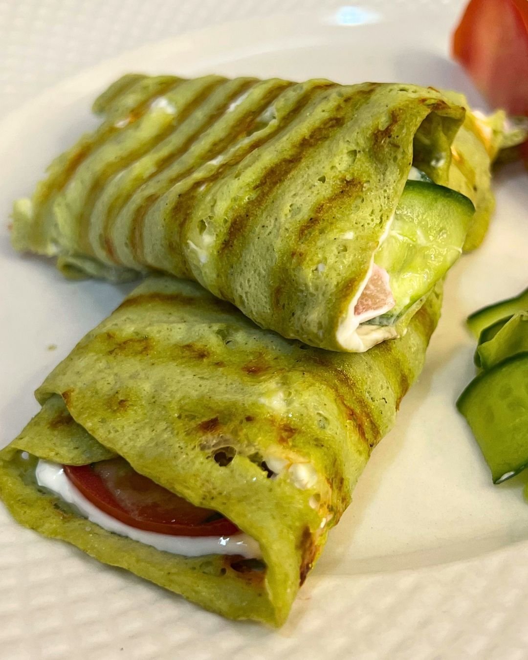 green avocado egg gluten free wrap filled with labneh cucumber and tomato gluten free healthy wrap