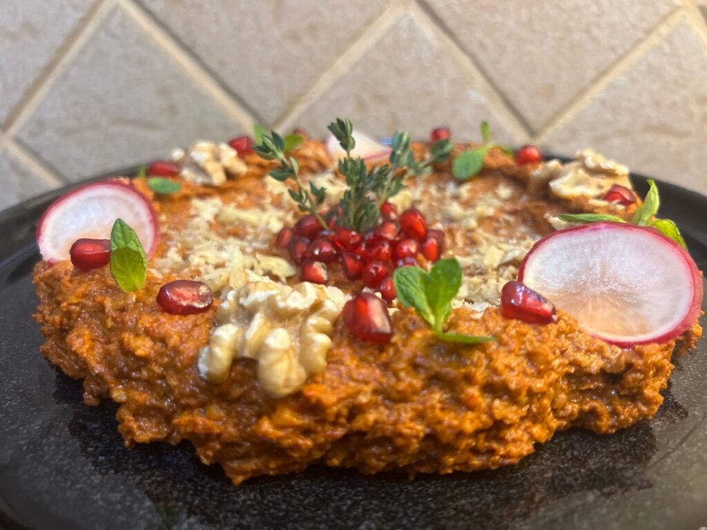 Close-up of easy Muhammara dip made with roasted red peppers, walnuts, and olive oil