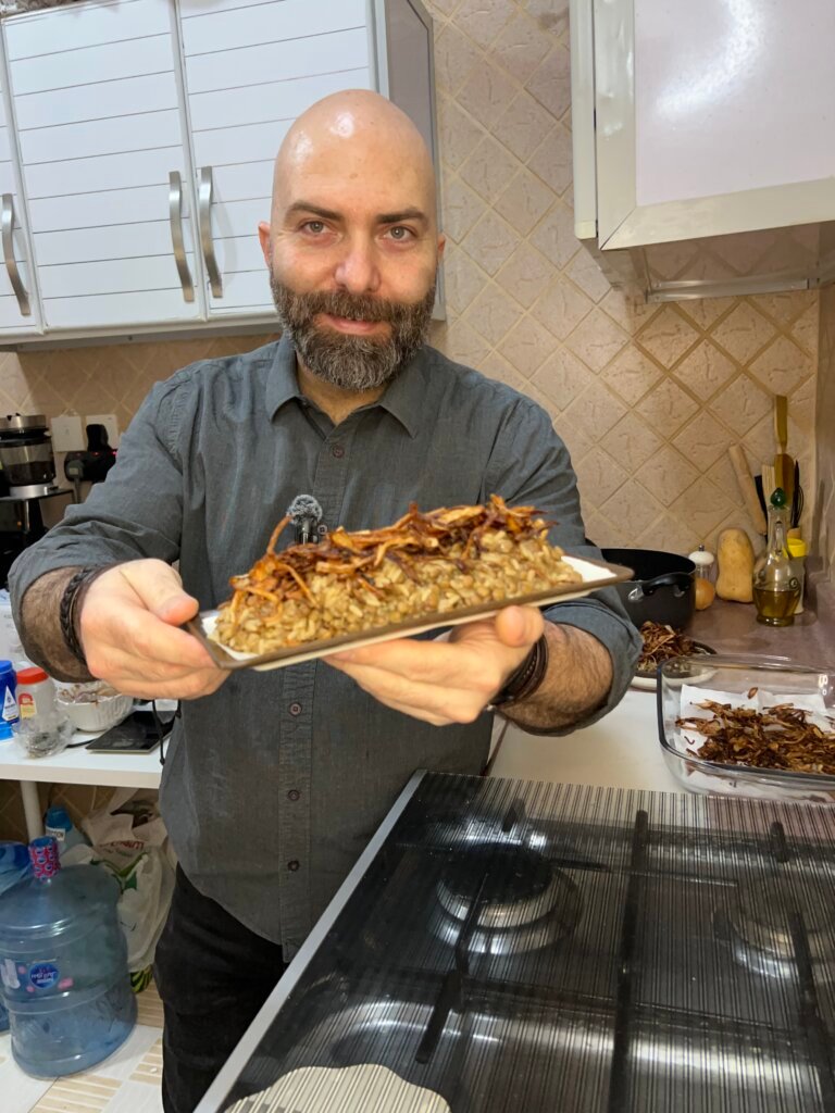chef Francois holding a dish of Lebanese mdardara