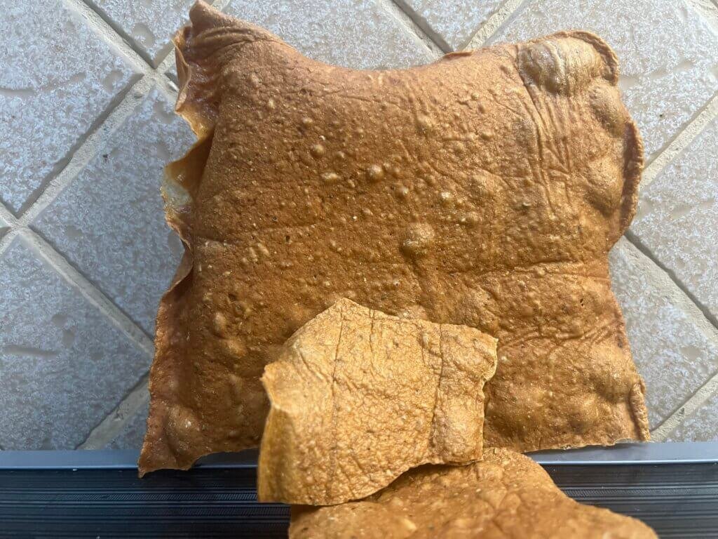 A whole sheet of baked high protein chicken crackers