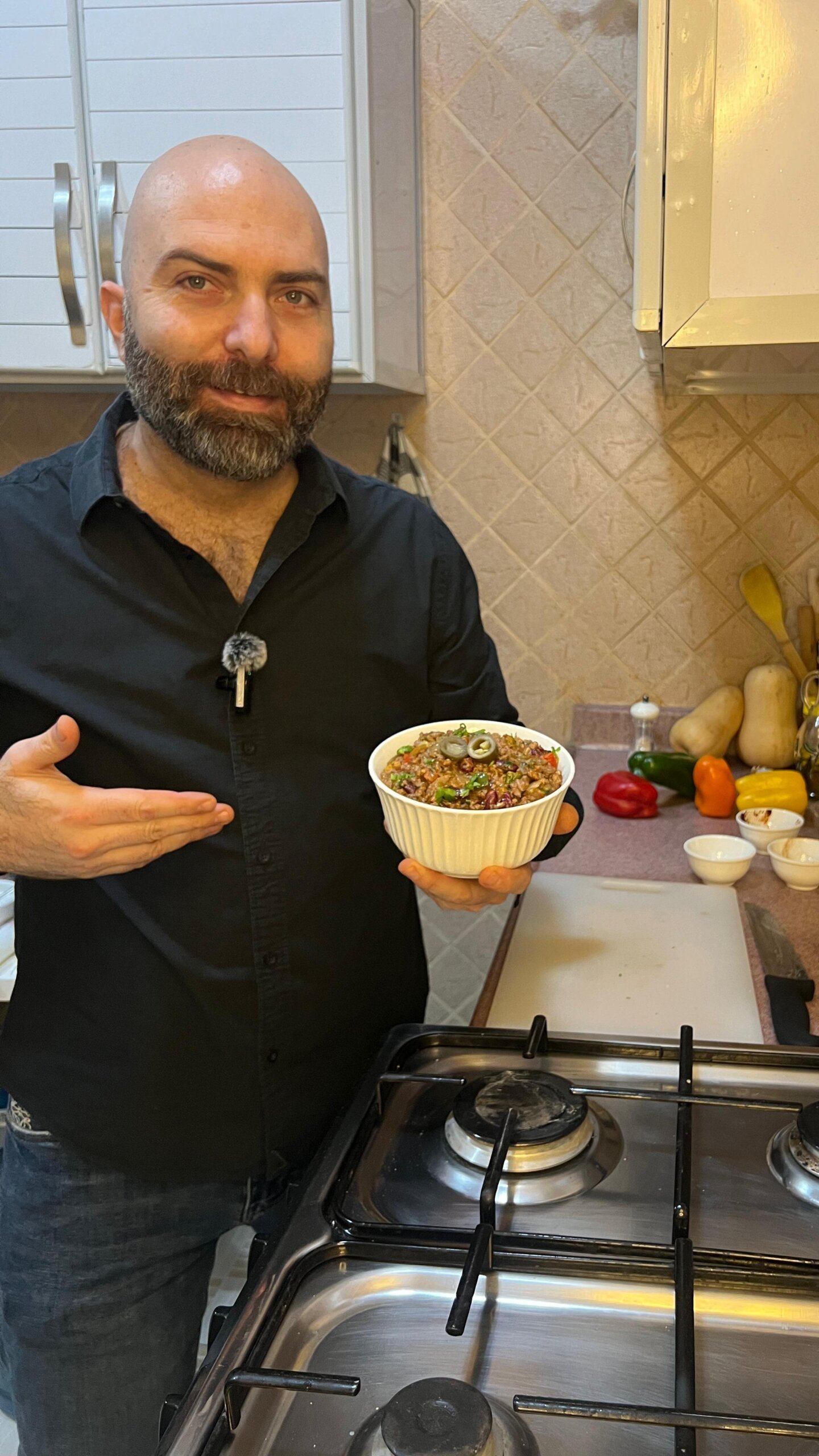 chef francois holding a small bowl of chili con carne