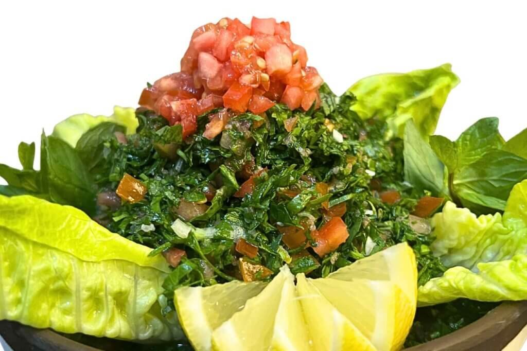 Authentic Lebanese tabbouleh salad made with finely chopped parsley, tomatoes, and fresh lemon.