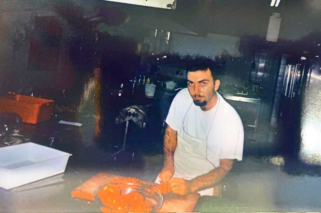 Young Chef François El Aaraj preparing fresh vegetables in the professional kitchen of Casino Piscine Aley during the early years of his culinary career.